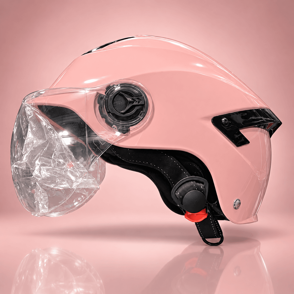 Pink open-face scooty helmet with clear visor and chin strap, side view
