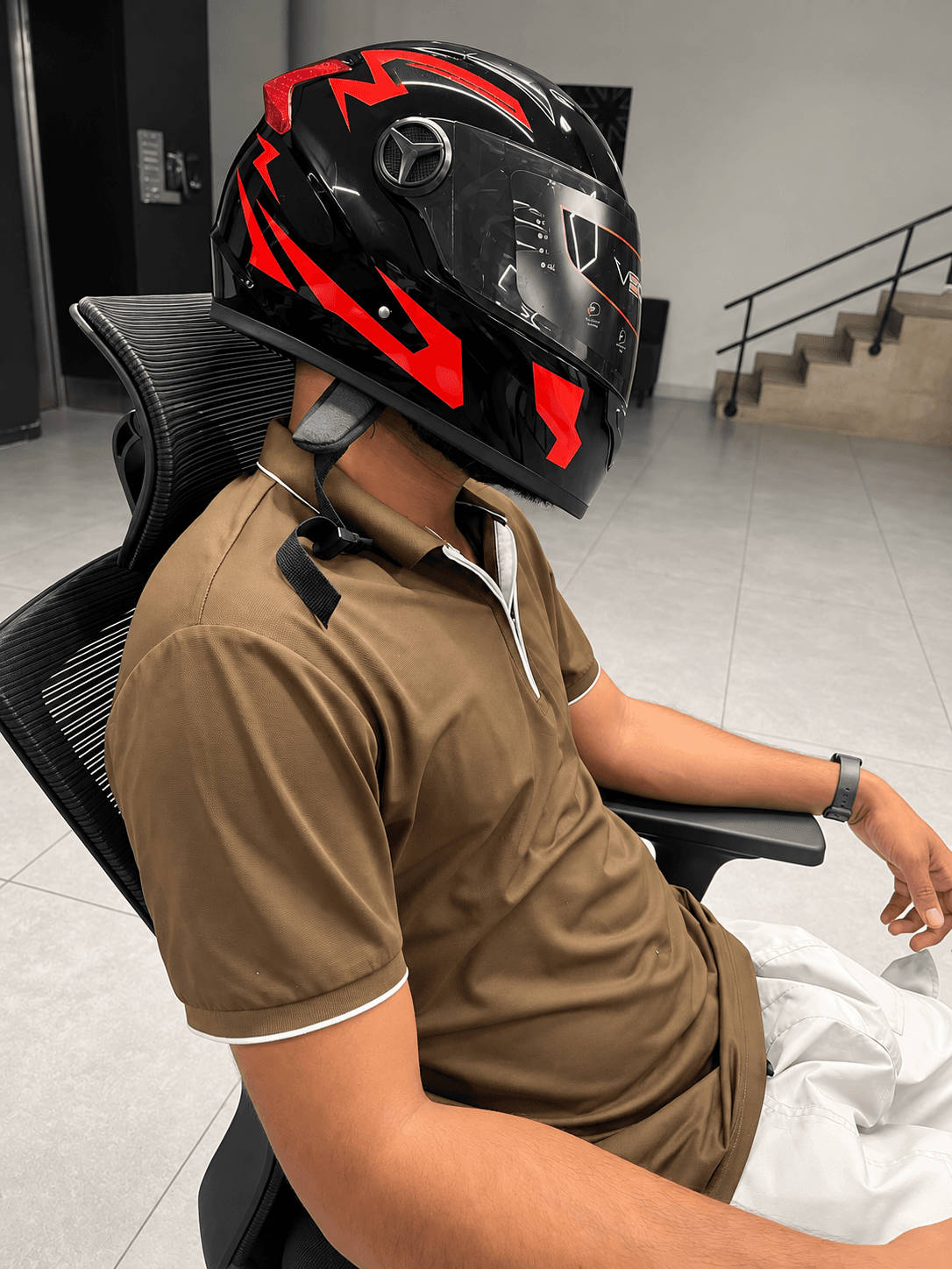 Black and red Vector full-face helmet side profile on a rider
