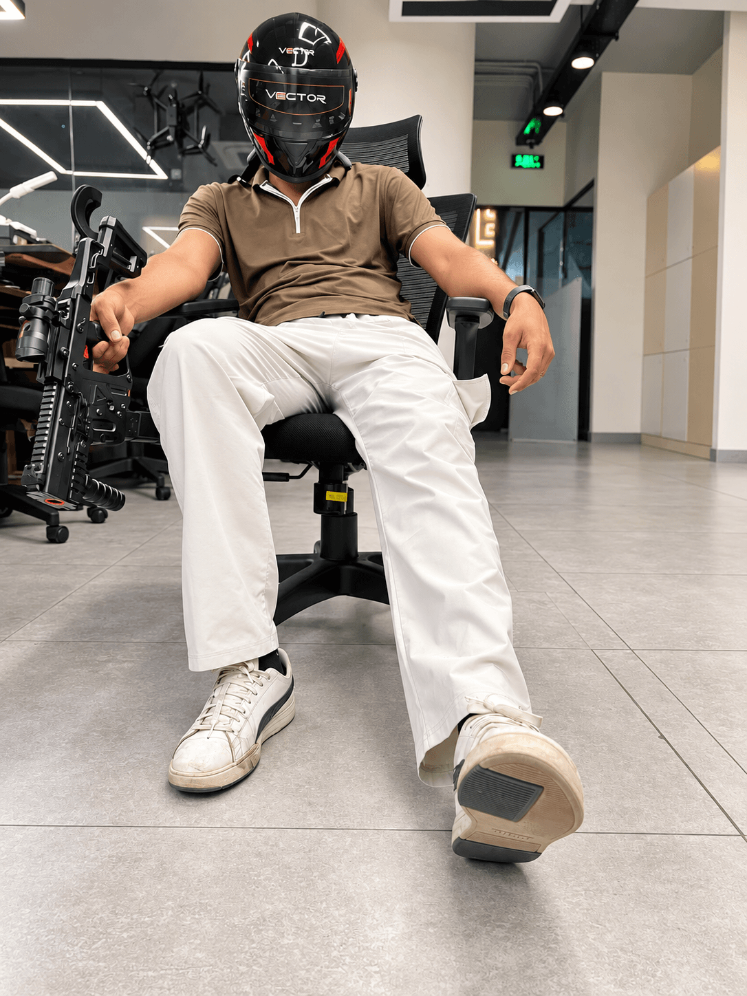 Seated rider wearing the black and red Vector helmet